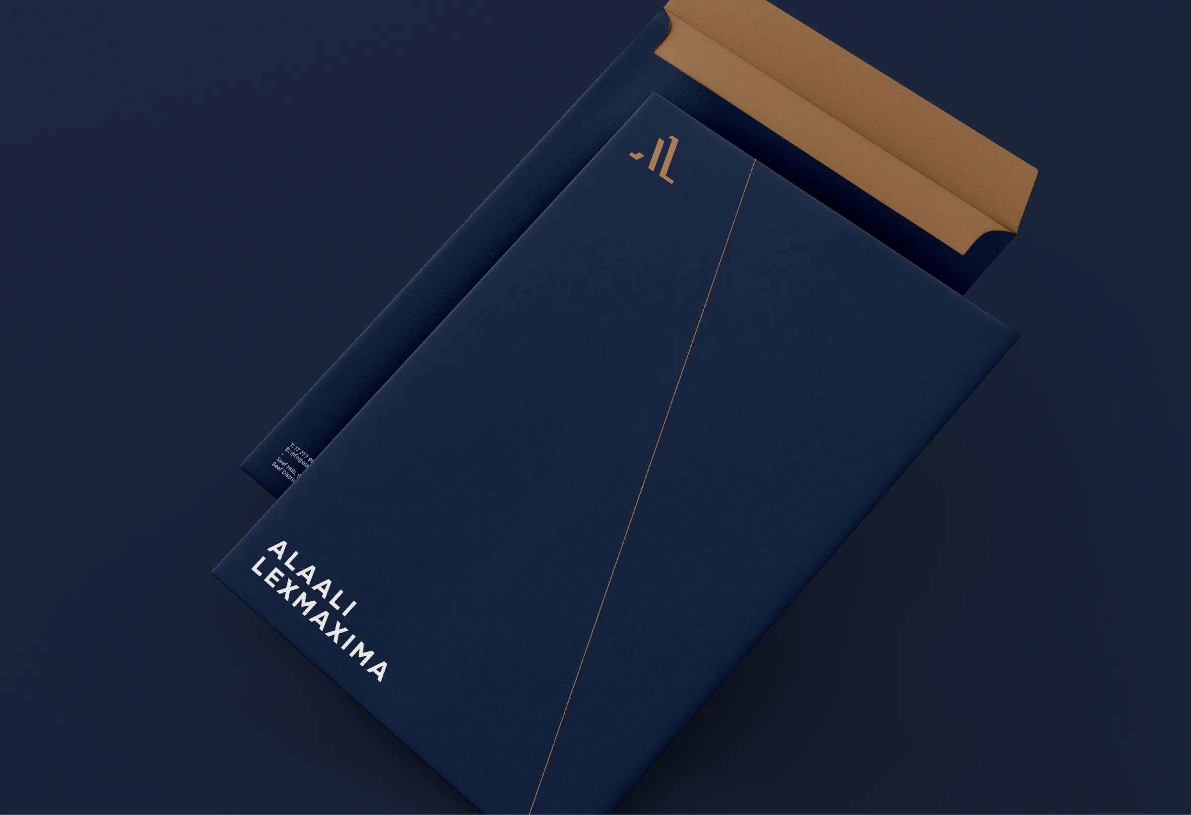 Navy Alaali LexMaxima envelope with a copper interior flap and white wordmark