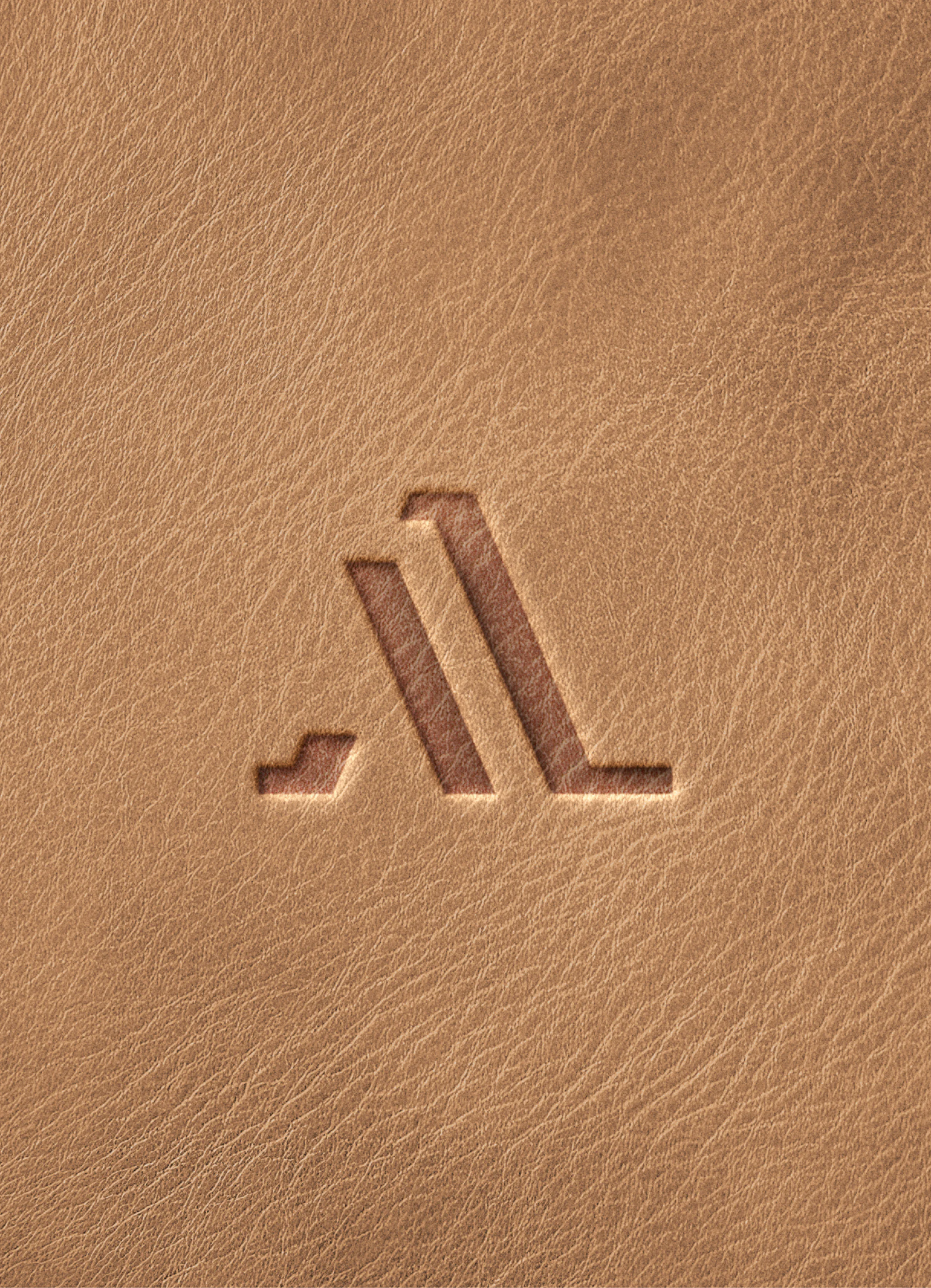 Alaali LexMaxima monogram debossed into tan leather