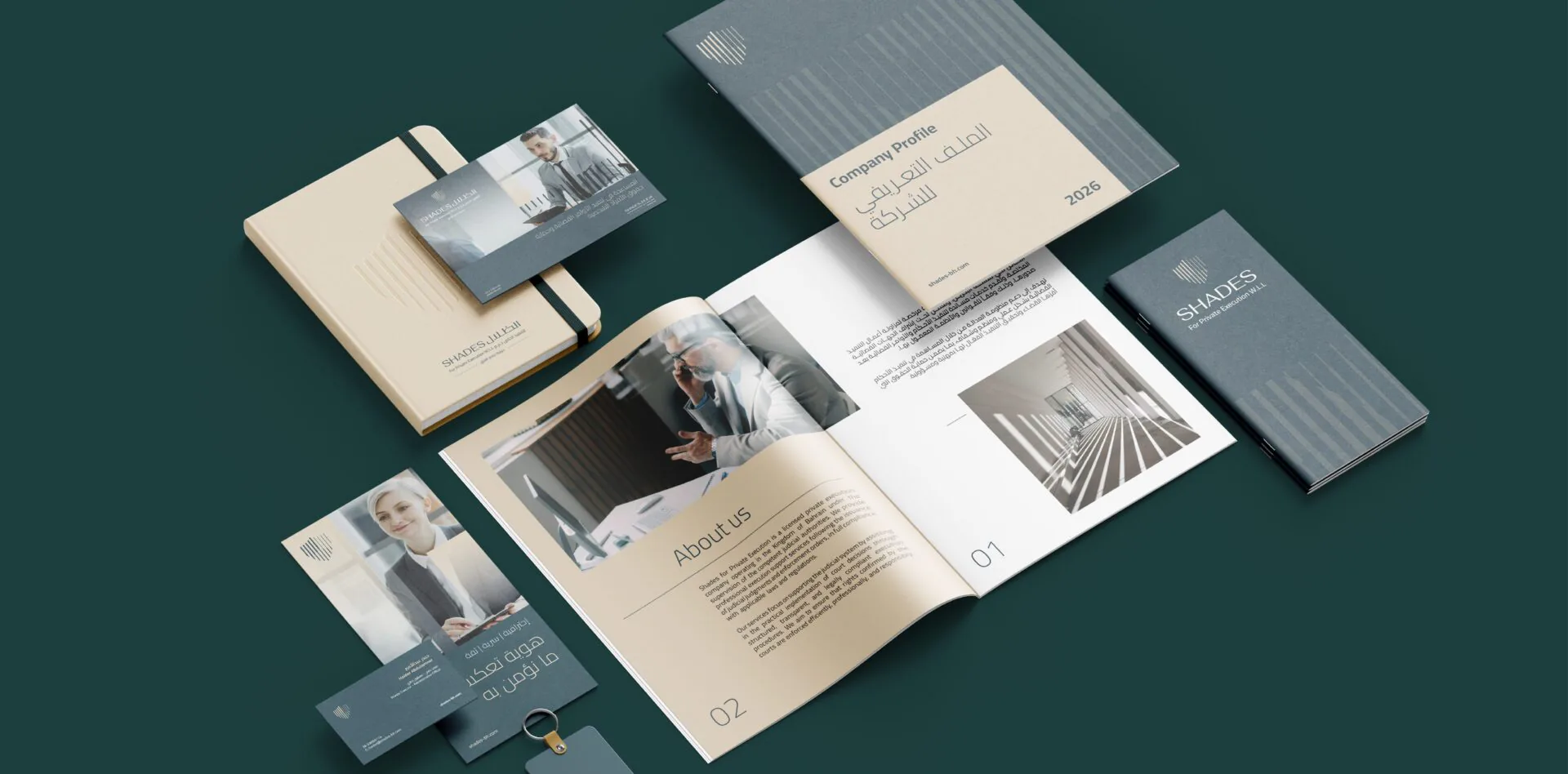 Shades Bailiff brand stationery — notebooks, brochures, cards and pen — flat-lay on dark teal
